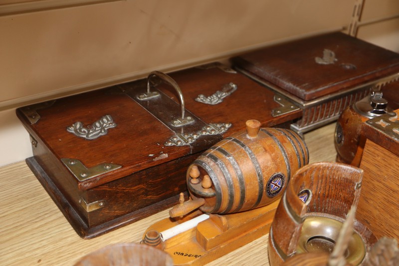 A collection of smoking and drinking paraphernalia including cigar boxes, ashtrays and bottle openers